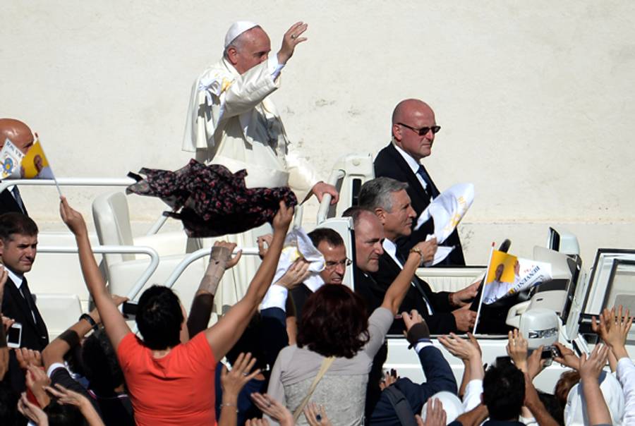 Pope Francis greets the crowd from the popemobile on October 19, 2014 at the Vatican.(FILIPPO MONTEFORTE/AFP/Getty Images))