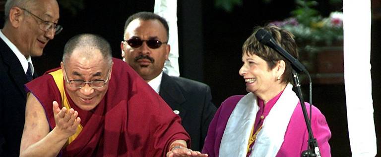 The Dalai Lama greets the public in Portland, Oregon, accompanied by the city's mayor, Vera Katz, on May 13, 2001.