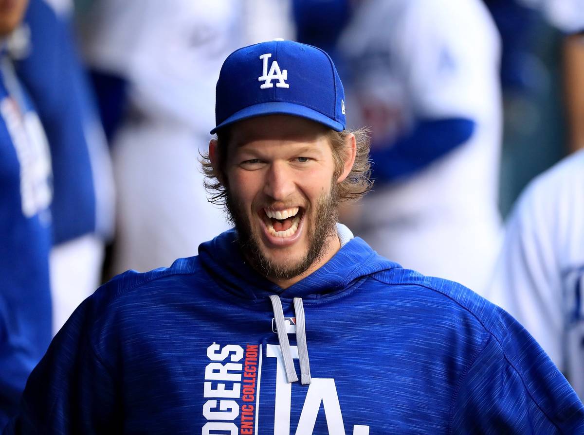 Clayton Kershaw laughs in the dugout before a game against the Pittsburgh Pirates at Dodger Stadium in Los Angeles, California, May 8, 2017. (Harry How/Getty Images)