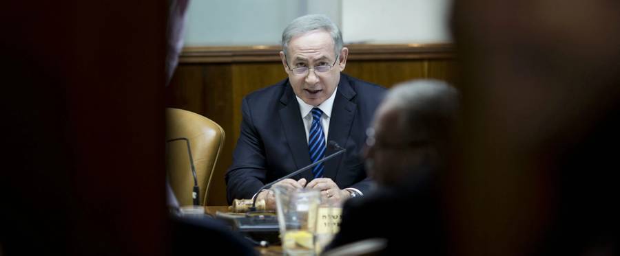 Israeli Prime Minister Benjamin Netanyahu chairs the weekly cabinet meeting at his office in Jerusalem on December 11, 2016. 