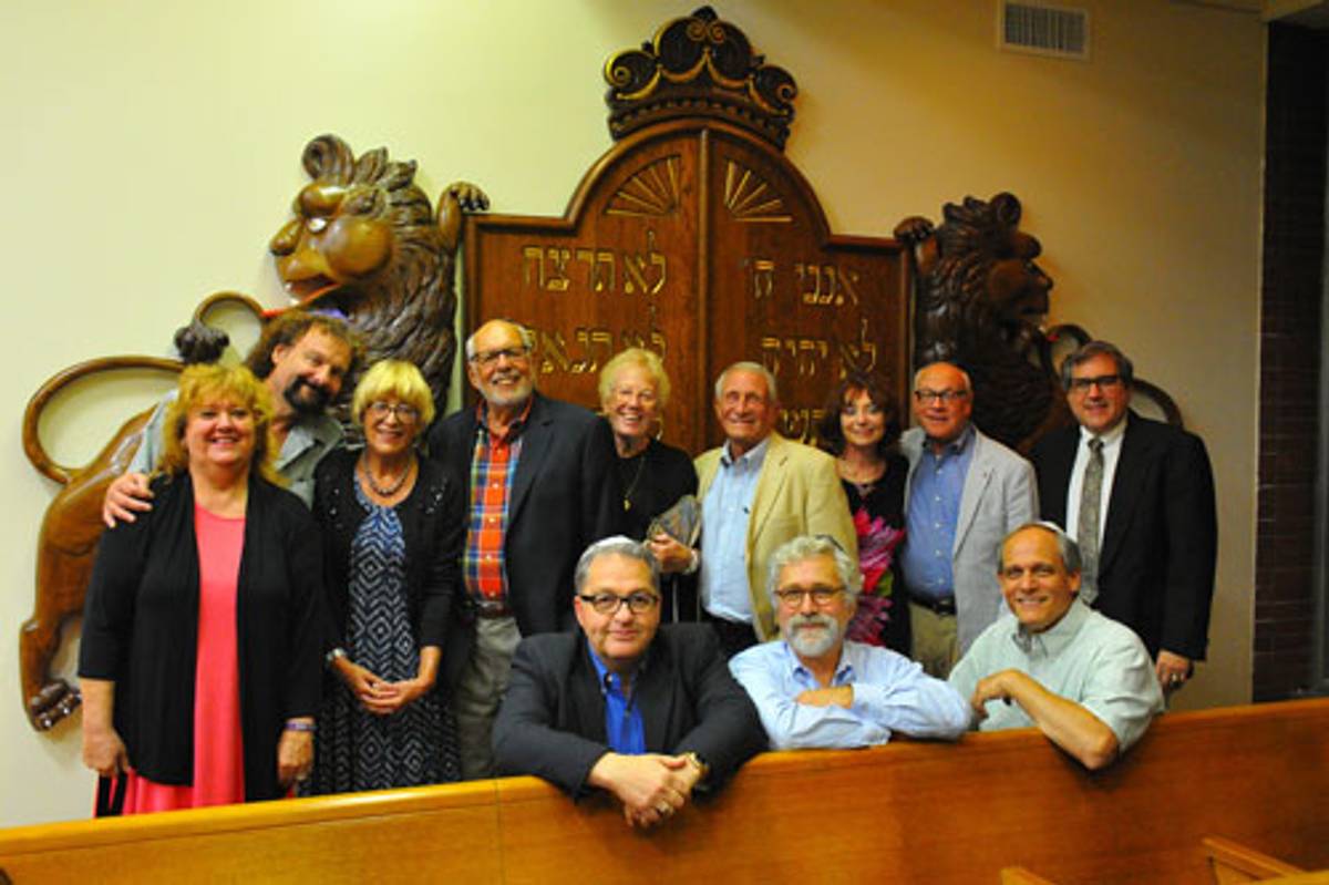 Members of B’nai Abraham Congregation and Temple Hadar Israel pose beside the newly refurbished Lions of Judah sculpture. Pictured: Sam Bernstine (bottom left) with Michael Kraus beside him, and Sybil Epstein (top row, third from left). (Photo: David Hoffman)