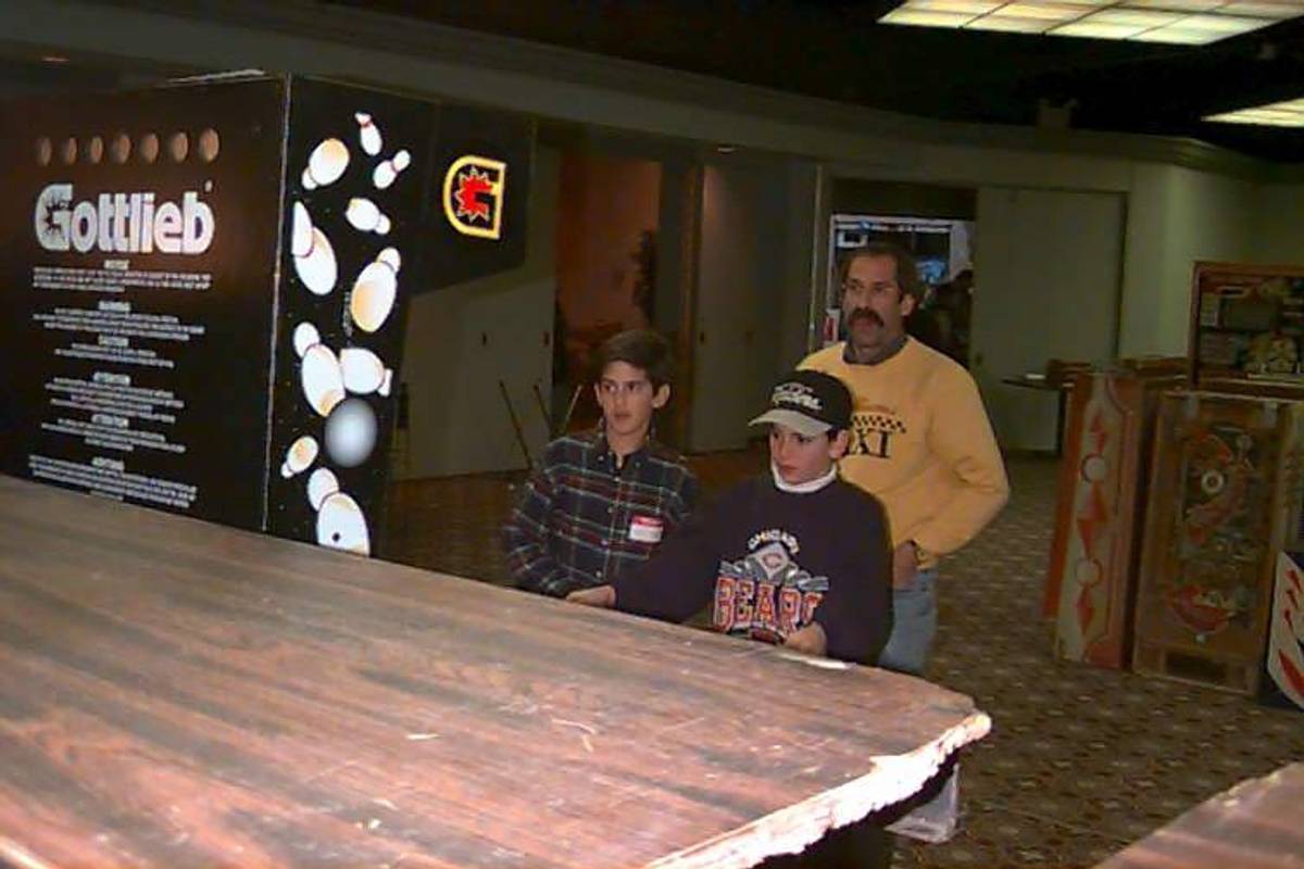 Zach and Josh Sharpe, then just kids, playing pinball with their father, Roger, a larger than legendary figure in the pinball community. CAPTION AND CREDIT HERE