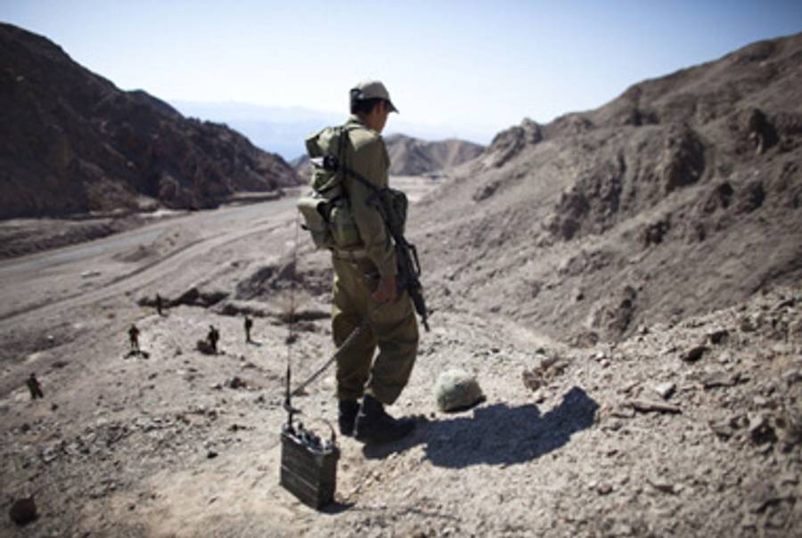 Israeli troops stand guard near the Egyptian border.(Uriel Sinai/Getty Images)