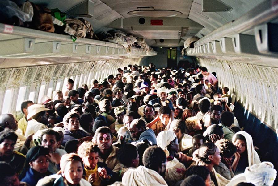 Ethiopian Jews sit on board an Israeli Air Force Boeing 707 during their transfer from Addis Ababa to Tel Aviv on May 25, 1991. (Patrick Baz/AFP/Getty Images)