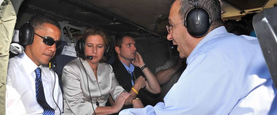 Barack Obama is briefed by Israeli Defense Minister Ehud Barak and Foreign Minister Tzipi Livni on the strategic balance of power in the Middle East as they sit in an Israeli Air Force helicopter before taking off for the southern town of Sderot on July 23, 2008 from a helipad in Jerusalem.