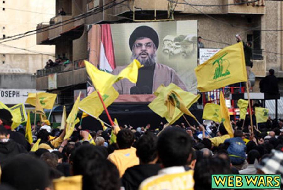 Hezbollah supporters watch Hassan Nasrallah deliver an address, 2008.(Joseph Barrak/AFP/Getty Images)