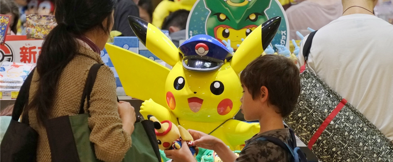 Customers visit a shop selling Pokémon goods in Tokyo, Japan, July 13, 2016. 