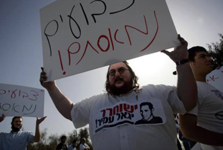 “Free Yigal Amir” protesters outside the Hasharon prison, near Tel Aviv, where he is being held.(David Furst/AFP/Getty Images)