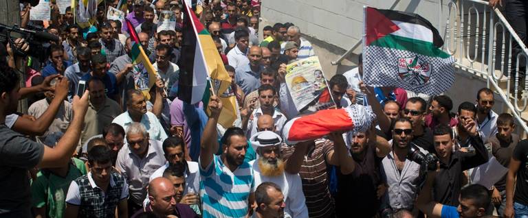 18-month-old Ali Saad Dawabsheh is carried during his funeral in the in the Palestinian village of Duma, West Bank, July 31, 2015. 
