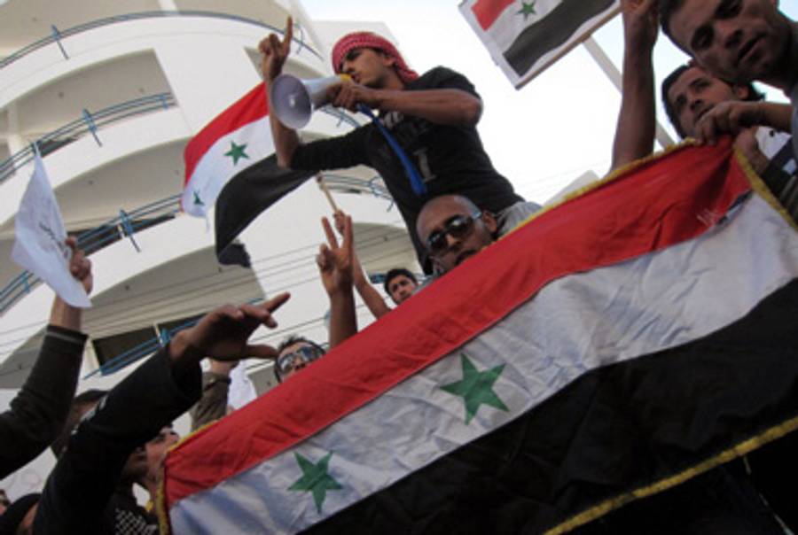 Expatriate Syrians in Cyprus protest against the Assad regime.(Gali Tibbon/AFP/Getty Images)