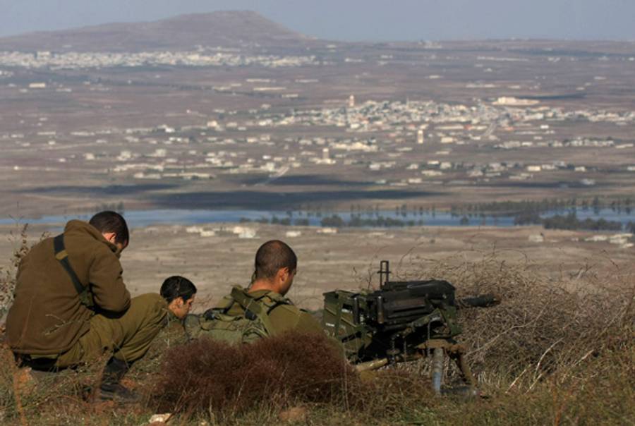 Israeli soldiers in an abandoned military outpost overlooking the ceasefire line between Israel and Syria on Tal Hazika near Alonei Habshan in the Golan Heights on November 15, 2012. (AFP/Getty Images)