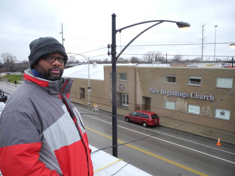 Pastor Corey Brooks camped on the roof of an abandoned motel across from his church to protest the violence on the South Side of Chicago and raise money to build a community center, Dec. 14, 2011