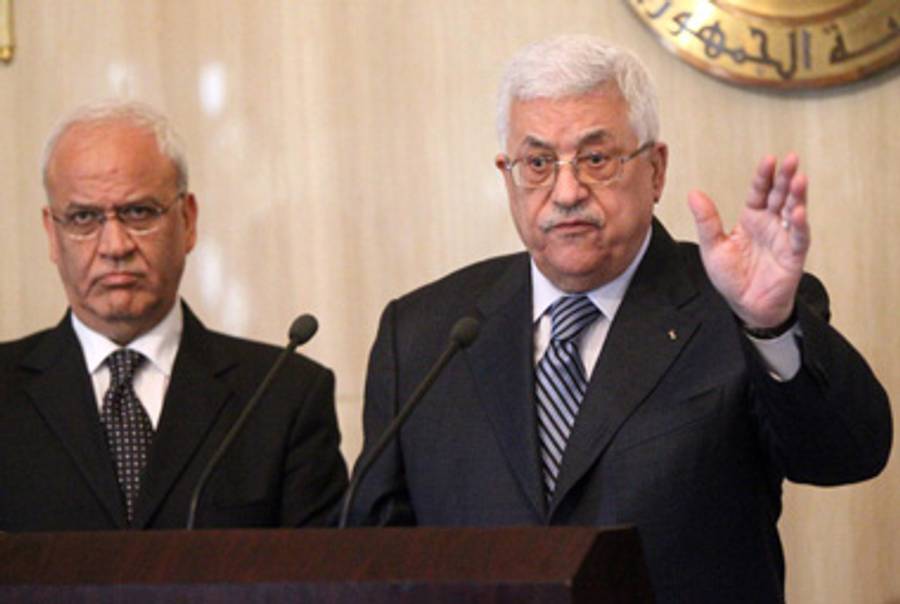 Palestinian negotiator Saeb Erekat (L) and President Mahmoud Abbas.(Khale Desouki/AFP/Getty Images)