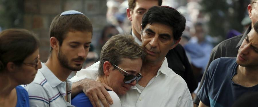 Simcha and Leah Goldin the parents of 23-year-old Israeli Lt. Hadar Goldin, mourn during his funeral at the military cemetery in the city of Kfar Saba on Aug. 3, 2014, after he was killed on Aug. 1 in combat in Rafah in the Gaza Strip.