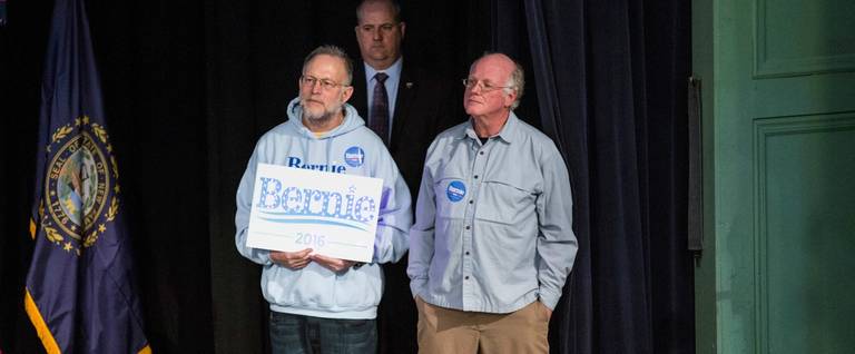 Jerry Greenfield (L) and Ben Cohen listen to Democratic presidential candidate Sen. Bernie Sanders (D-VT) speak at a rally after endorsing him on stage in the Exeter town hall in New Hampshire, February 5, 2016