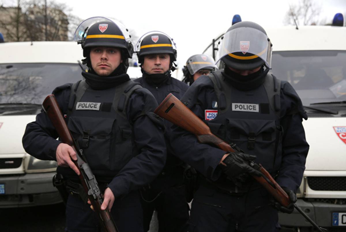 Police arrive with guns at Port de Vincennes on January 9, 2015 in Paris, France, where according to reports at least five people have been taken hostage in a kosher deli.(Dan Kitwood/Getty Images)