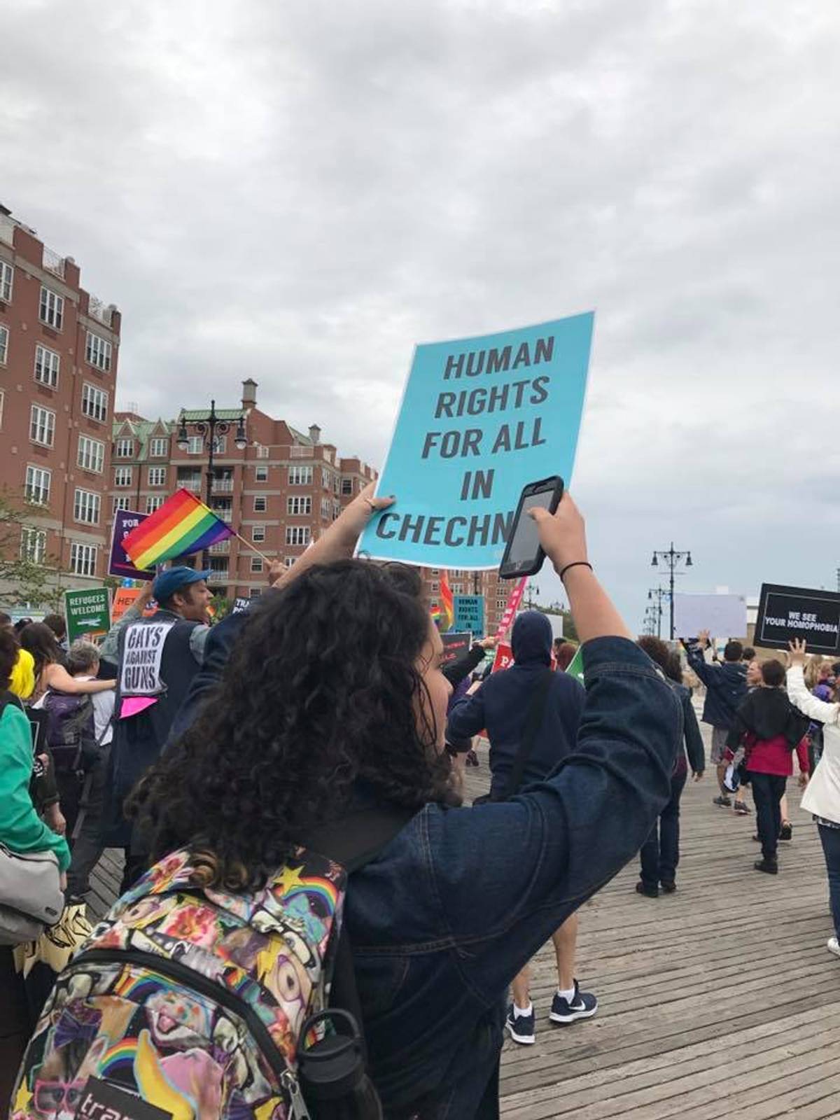 A woman holds a sign that reads “Human Right for All in Chechnya. (Facebook/RUSA LGBT)