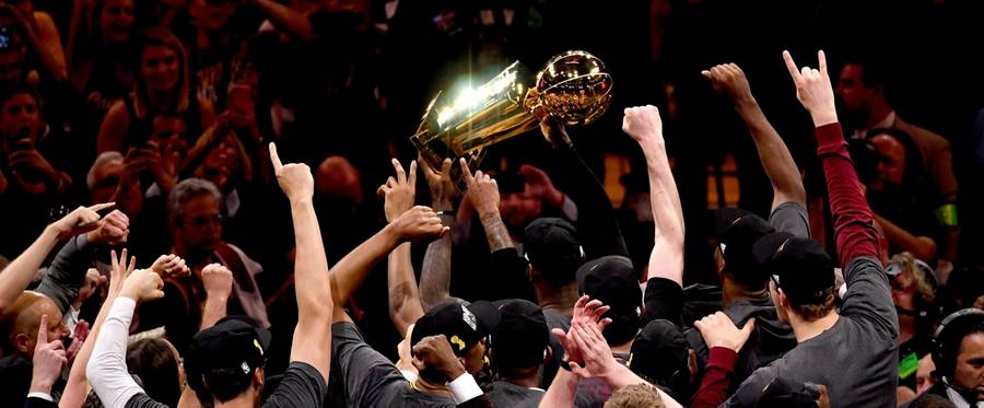 LeBron James #23 of the Cleveland Cavaliers holds the Larry O'Brien Championship Trophy after defeating the Golden State Warriors 93-89 in Game 7 of the 2016 NBA Finals at ORACLE Arena in Oakland, California, June 19, 2016. 