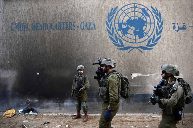 Israeli soldiers operate next to the UNRWA headquarters, where the IDF uncovered a Hamas command tunnel running underneath the U.N. compound in the Gaza Strip, Feb. 8, 2024