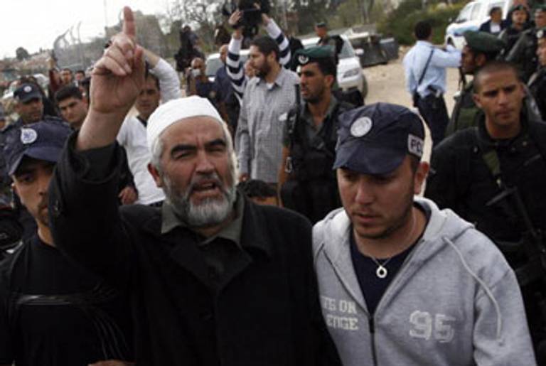 Israeli policemen arrest Palestinian Sheikh Raed Salah, head of the Arabic Israeli Islamic Movement, in March(Ahmad Gharabli/AFP/Getty Images)
