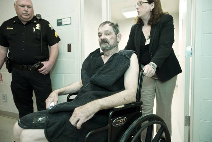  Frazier Glenn Cross, Jr., also known as F. Glenn Miller, appears at his arraignment on capital murder and first-degree murder charges at the Fred Allenbrand Criminal Justice Complex Adult Detention Center on April 15, 2014 in New Century, Kansas. (David Eulitt-Pool/Getty Images)