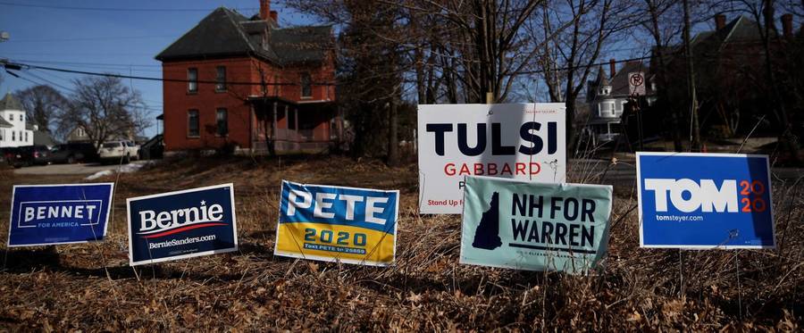 Feb. 5, 2020: Yard signs for Democratic presidential candidates are posted in front of a home in Manchester, New Hampshire