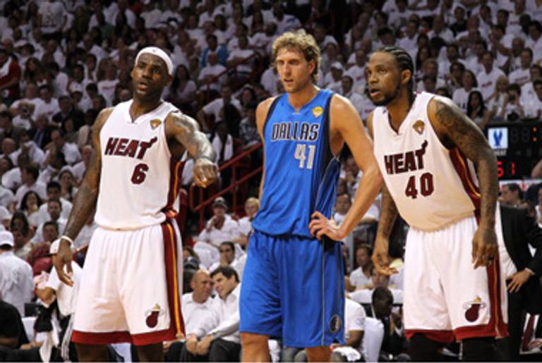 LeBron James (L) and Dirk Nowitzki (C) last night.(Mike Ehrmann/Getty Images)