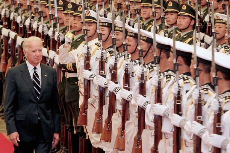 U.S. Vice President Joe Biden views an honor guard during a welcoming ceremony inside the Great Hall of the People in Beijing, on Aug. 18, 2011