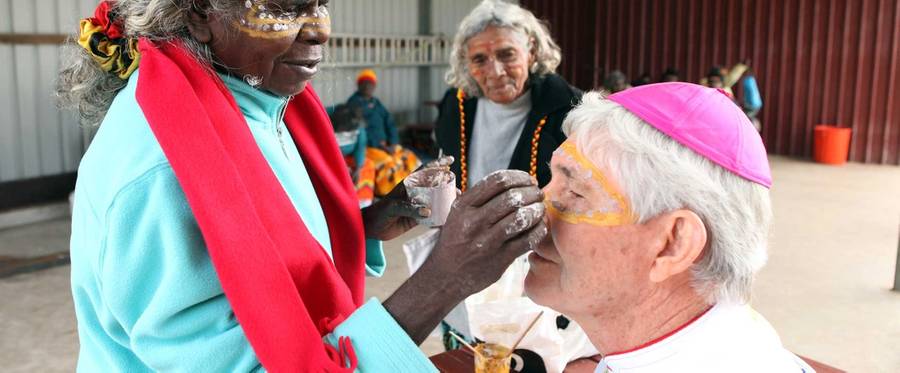 Bishop Eugene Hurley of Darwin gets his face painted with an Aboriginal pattern before a Mass, during celebrations to mark the canonization of Mary MacKillop on Oct. 17, 2010, in Penola, Australia.