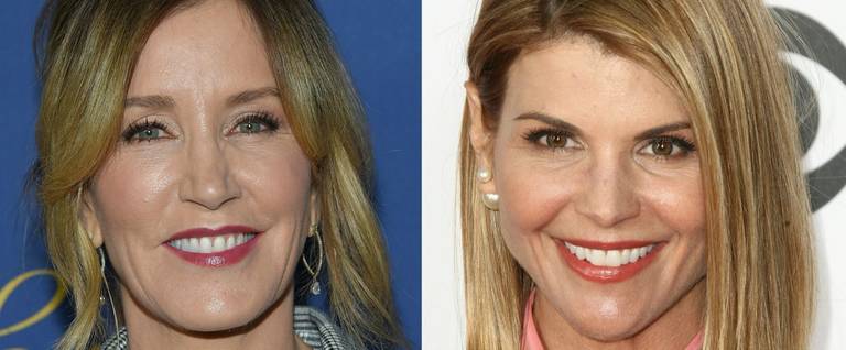 This combination of pictures created on March 12, 2019 shows US actress Felicity Huffman(L) attending the Showtime Emmy Eve Nominees Celebration in Los Angeles on September 16, 2018 and actress Lori Loughlin arriving at the People's Choice Awards 2017 at Microsoft Theater in Los Angeles, California, on January 18, 2017. - Two Hollywood actresses including Oscar-nominated 'Desperate Housewives' star Felicity Huffman are among 50 people indicted in a nationwide university admissions scam, court records unsealed in Boston on March 12, 2019 showed. The accused, who also include chief executives, allegedly cheated to get their children into elite schools, including Yale, Stanford, Georgetown and the University of Southern California, federal prosecutors said.Huffman, 56, and Lori Loughlin, 54, who starred in 'Full House,' are charged with conspiracy to commit mail fraud and honest services mail fraud.