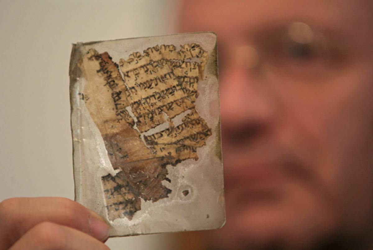 A 1,000-year-old parchment from a Hebrew Bible manuscript is displayed at Jerusalem's Yad Ben-Zvi institute Dec. 2, 2007. The institute said the scrap forms part of the Aleppo Codex and was kept as a lucky charm by Sam Sabbagh, a Syrian Jew who in 1947 plucked it from the floor of an Aleppo synagogue that was torched after the United Nations vote to partition Palestine.(Ammar Awad/Reuters)