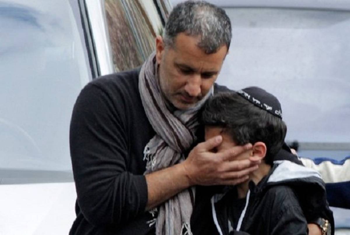 A student being escorting from the Ozar Hatorah school in Toulouse following the 2012 shooting.(Reuters)