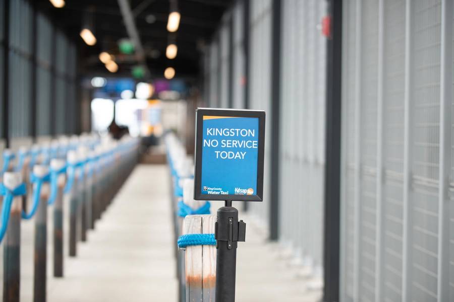A sign informs customers of a canceled ferry route at the Water Taxi Terminal during a ferry workers 'sickout' in downtown Seattle, 2021