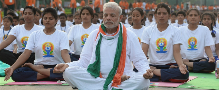 Indian Prime Minister Narendra Modi (C) participates in a mass yoga session on International Yoga Day on Rajpath, New Delhi, India, June 21, 2015. 