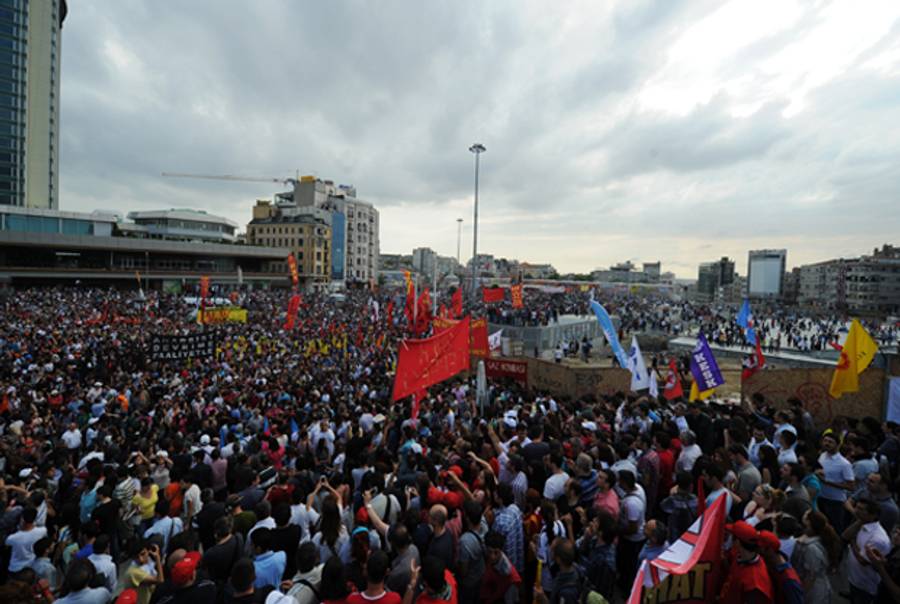 Protestors gather on Taksim square on June 2, 2013, a day after Turkish police pulled out of Istanbul's iconic square following a second day of violent clashes between protesters and police over a controversial development project. (BULENT KILIC/AFP/Getty Images)