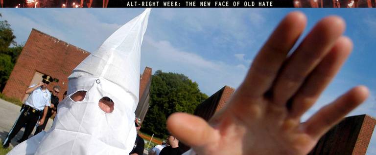 A member of the Ku Klux Klan salutes during American Nazi Party rally at Valley Forge National Park September 25, 2004 in Valley Forge, Pennsylvania.
