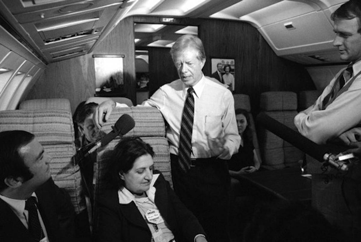 President Jimmy Carter and press secretary Jody Powell, right, talk with reporters Helen Thomas, center, and Sam Donaldson, left, on Air Force One in 1979.(AP)