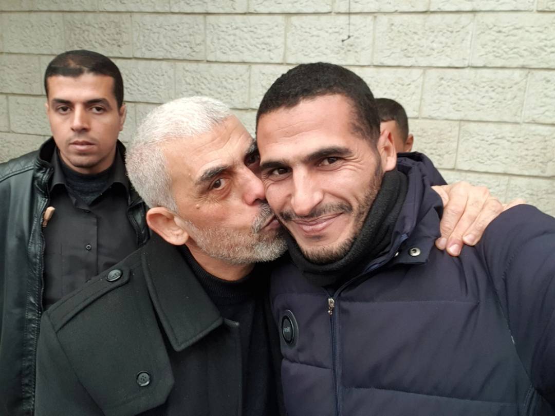 Hamas leader Yahya Sinwar kissing photojournalist Hassan Eslaiah, posted on Eslaiah's X account in 2020