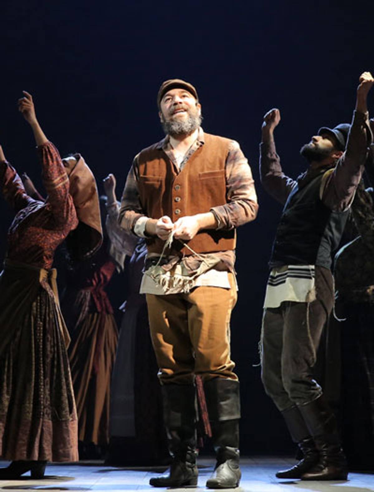 Danny Burstein (center) as Tevye, with cast members. (Photo: Joan Marcus)
