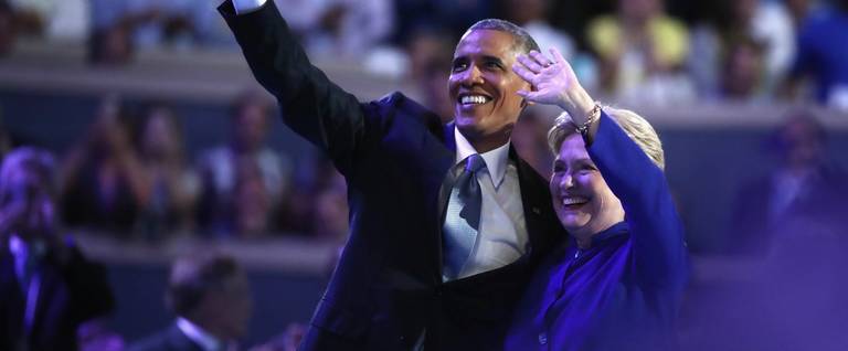 President Barack Obama and Democratic presidential nominee Hillary Clinton acknowledge the crowd on the third day of the Democratic National Convention at the Wells Fargo Center, July 27, 2016 in Philadelphia, Pennsylvania. 