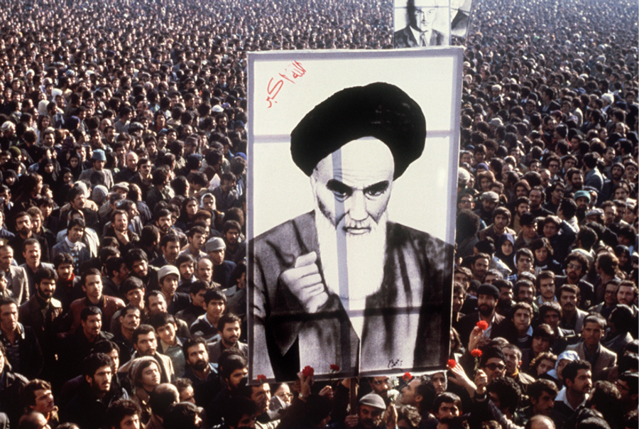Iranian protesters hold a up a poster of Ayatollah Ruhollah Khomeini during a demonstration in Tehran against the shah in January 1979. (AFP/Getty Images)