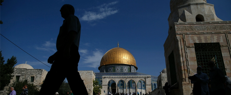 A Palestinian man walks past the Dome of Rock at the Al-Aqsa Mosque compoundin Jerusalem's Old City, November 11, 2016. 