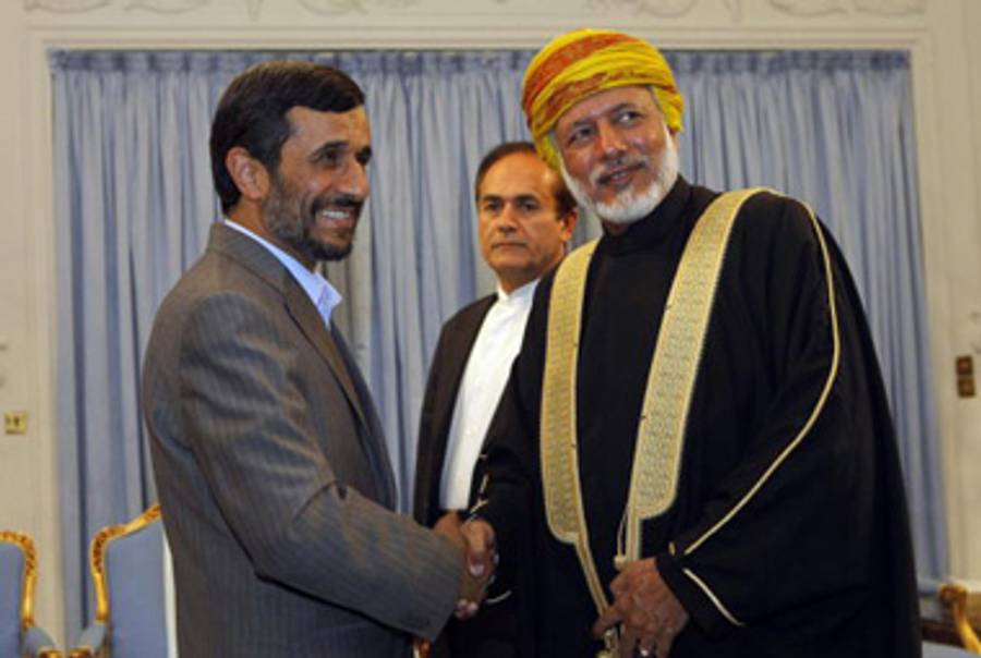 Amadinejad doing presidenty things, like receiving the Omani foreign minister, last week.(Behrouz Mehri/AFP/Getty Images)