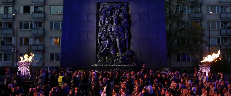 People attend an evening concert at the Ghetto Heroes Monument as part of commemorations marking the 75th anniversary of the Warsaw Ghetto Uprising on April 19, 2018 in Warsaw, Poland.