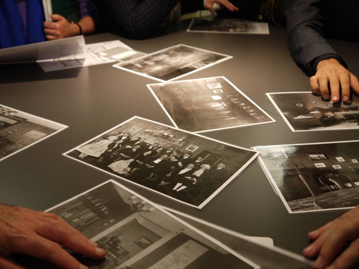 Photos of the Hahn family, looked at in Merkelstrasse 3, the original Hahn family home. At center is a photo of Max Raphael Hahn’s 50th birthday, taken in 1930. (Photo: Hayden Family)