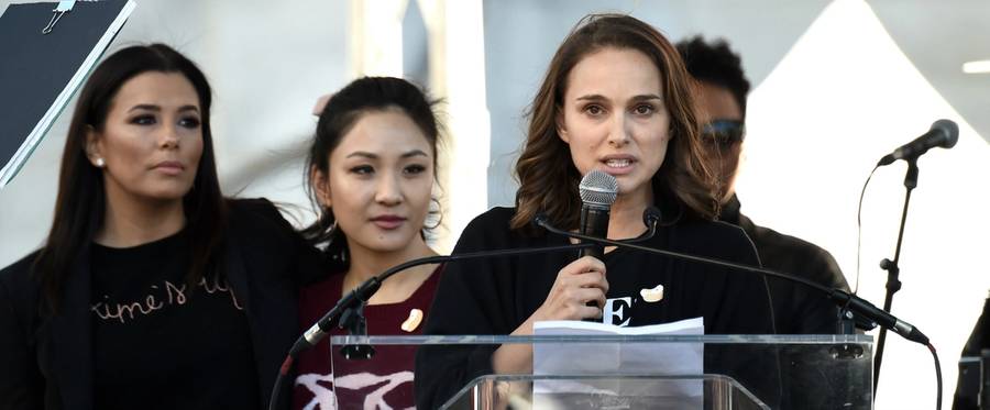 Eva Longoria, Constance Wu, and Natalie Portman speak onstage at 2018 Women's March Los Angeles on Jan. 20, 2018. 