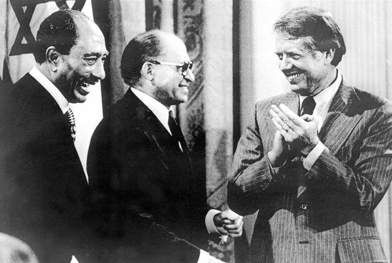 President Anwar Sadat, Prime Minister Menachem Begin, and President Jimmy Carter at the concluding ceremony of the Camp David Summit in the East Room of the White House on Sept. 17, 1978.(AFP/Getty Images)
