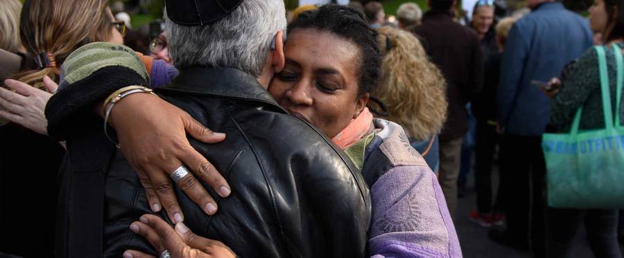 Two protesters hug during a march for solidarity while President Donald Trump was visiting in Pittsburgh on Oct. 30, 2018. The march was in support of the victims of the Tree of Life mass shooting on Oct. 27, 2018.