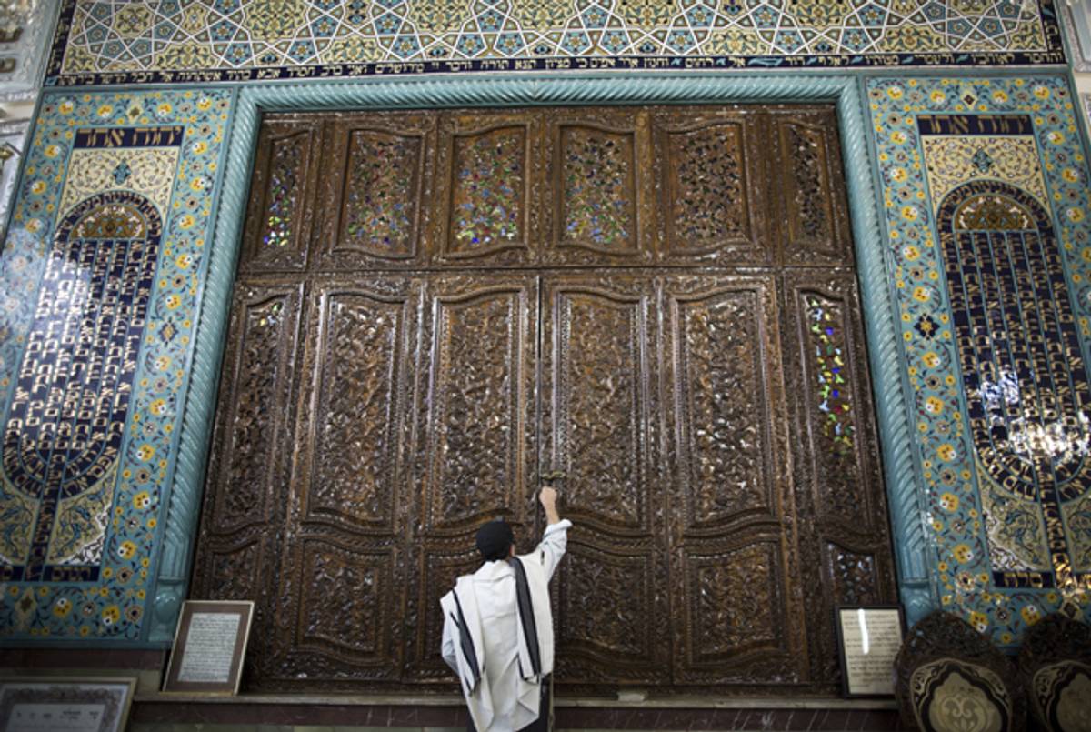 Es'hagh Akhamzadeh during morning prayers at Youssef Abad synagogue in Tehran on September 30, 2013. (BEHROUZ MEHRI/AFP/Getty Images)