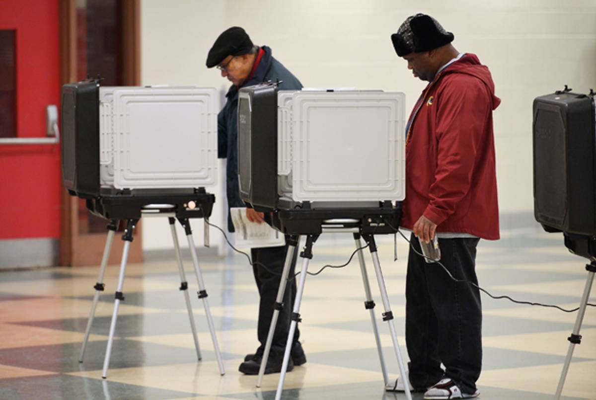 Voters cast their ballots in a polling station at Wheaton High School on November 6, 2012 in Silver Spring, Maryland. (MANDEL NGAN/AFP/Getty Images)